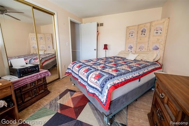 Bedroom with a closet and light wood-type flooring