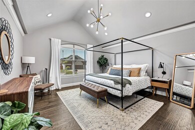 Retreat to your large primary bedroom with vaulted