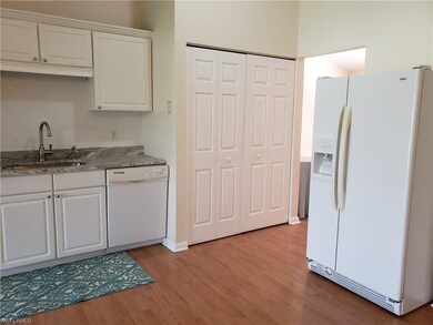 Kitchen has laundry closet with washer and dryer