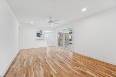 Another view of the Family room w/ double pane sliding glass doors leading to back patio.