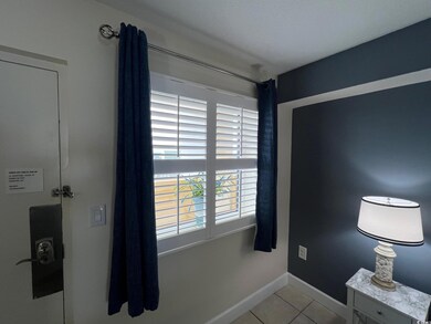 Interior space with light tile patterned flooring