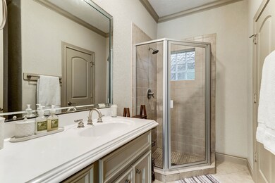First floor ensuite bathroom features a large vani