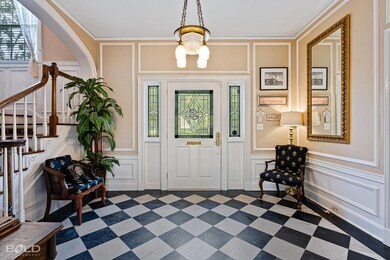 Foyer with black and white marble and commissioned