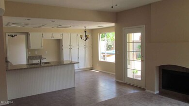 Kitchen open to family room with FP!