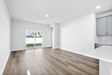 Unfurnished living room with light hardwood / wood