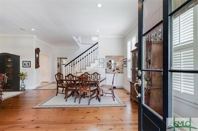 Living room with heart of pine flooring as through