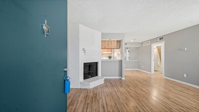 Spacious living area with a fireplace and luxury v