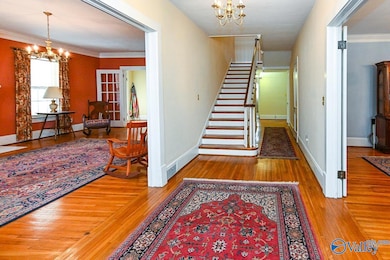 Original hard wood floors through out the home. A grand staircase with stained glass window at the first landing.