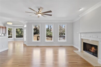 Living room featuring sink, crown molding, ceiling