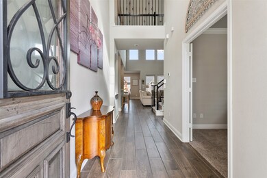 Welcome home to 15306 Sanford Springs Trail. Enter through a beautiful wood glass door to soaring ceilings, neutral paint and gorgeous tile floors that look like hardwood.