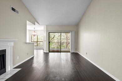 Unfurnished living room featuring wood-type floor