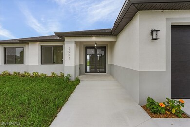Property entrance featuring a garage and french do