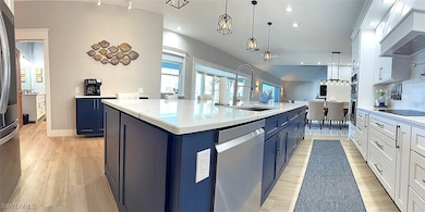 Kitchen featuring a sink, appliances with stainles