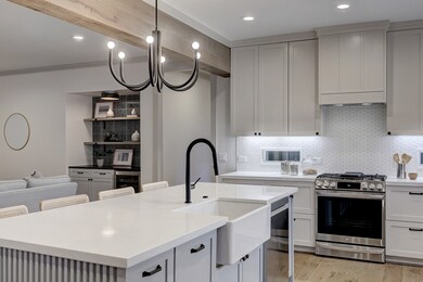 The kitchens design is anchored by a striking blac