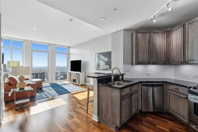 Kitchen featuring expansive windows, sink, decorat