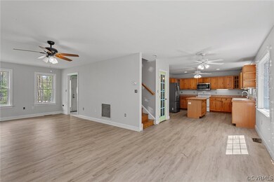 Kitchen featuring sink, light hardwood / wood-style flooring, a center island, and appliances with stainless steel finishes