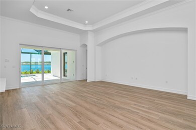 Empty room featuring crown molding, a towering cei