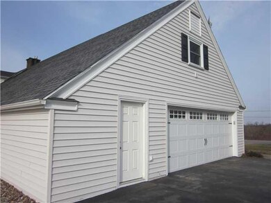 Parking Lot/Garage. Man door is to workshop.