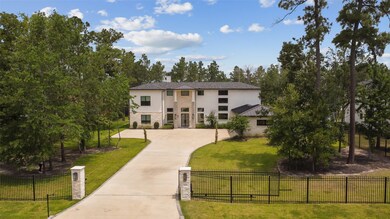 The home is securely enclosed by an electronically automated gate, offering both privacy and convenience with advanced access control.
