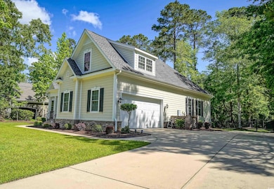 View of front of property with a shingled roof, a 