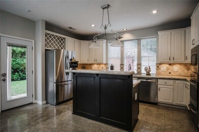 This striking kitchen features ample counter space