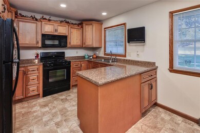 Charming kitchen with window that looks toward the