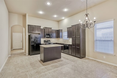 The kitchen features granite countertops, tile backsplash, 18