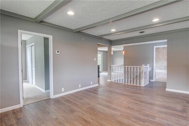 Living Room with exposed beams. Open to kitchen an