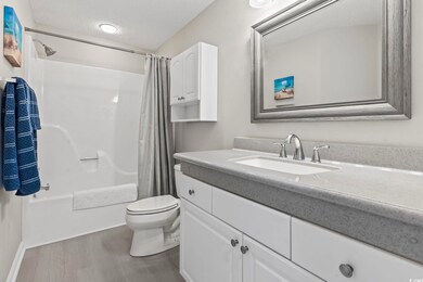 Bathroom with vanity, shower / bathtub combination