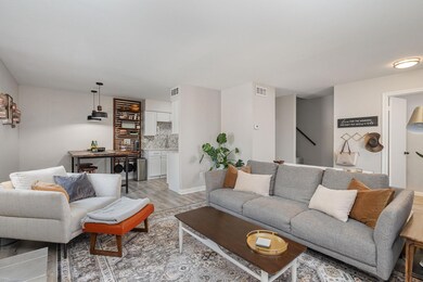 Living room with light wood-type flooring