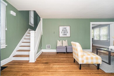 A T Stair case connect the Entry and the Kitchen to the Upper Level.  You can see the classic proportion of the hardwood stair system.