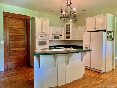 Spacious kitchen with island ready for bar stools.