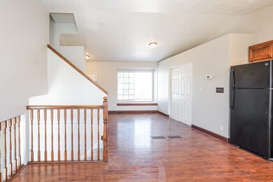 Foyer featuring wood finished floors and baseboards