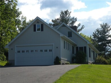The attached two car garage will permit you to jus