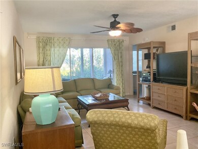 Tiled living room with ceiling fan