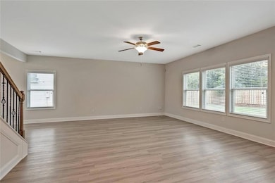 Empty room featuring light wood-type flooring, a w
