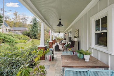 Warm and Welcoming rocking chair front porch with built in speaker system - did someone say porch party?