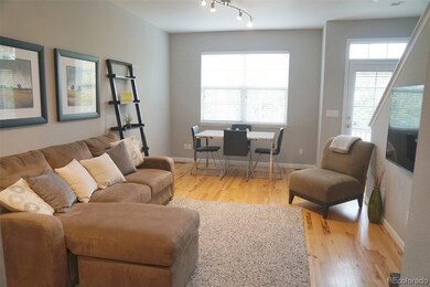 Hardwood floors in living and dining room.  Window