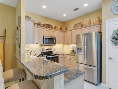 GORGEOUS COUNTERS AND STAINLESS APPLIANCES IN THE