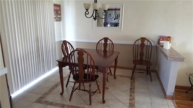Dining room area with ceramic tile flooring