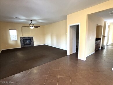 Unfurnished living room featuring a tiled fireplac