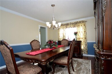 Formal dining room with hardwood floors, NEW light