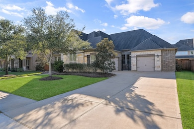 A double-wide driveway along the north side of thi