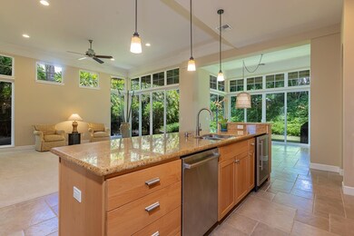 The kitchen connects seamlessly to the living and dining areas.
