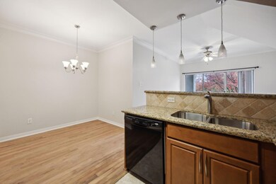 Kitchen featuring backsplash, sink, light stone co
