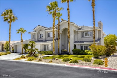 View of front of home with a chimney, driveway, stucco siding, and a front lawn