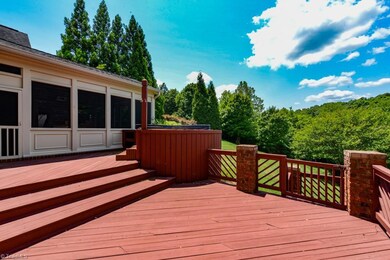 Large deck overlooking grassy yard area