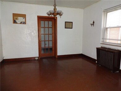 Thru the dining room door is a den and powder room