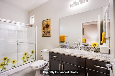 Full bathroom featuring a shower stall, tile patte