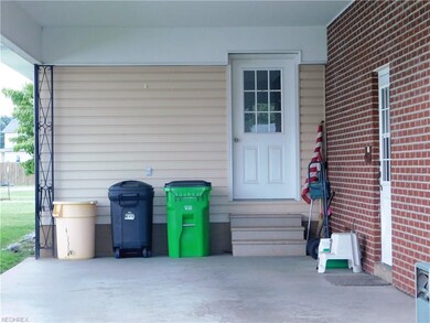 Door to 12x13 workshop in the back of the carport.